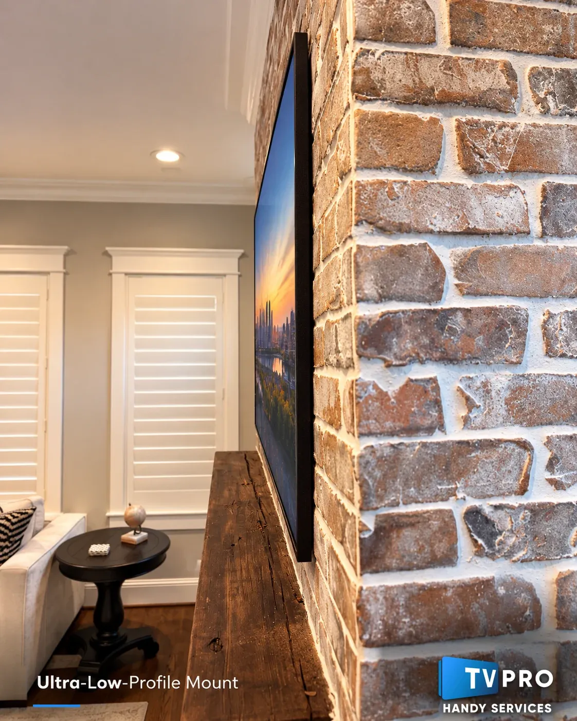 Ultra-low-profile TV mount on brick accent wall